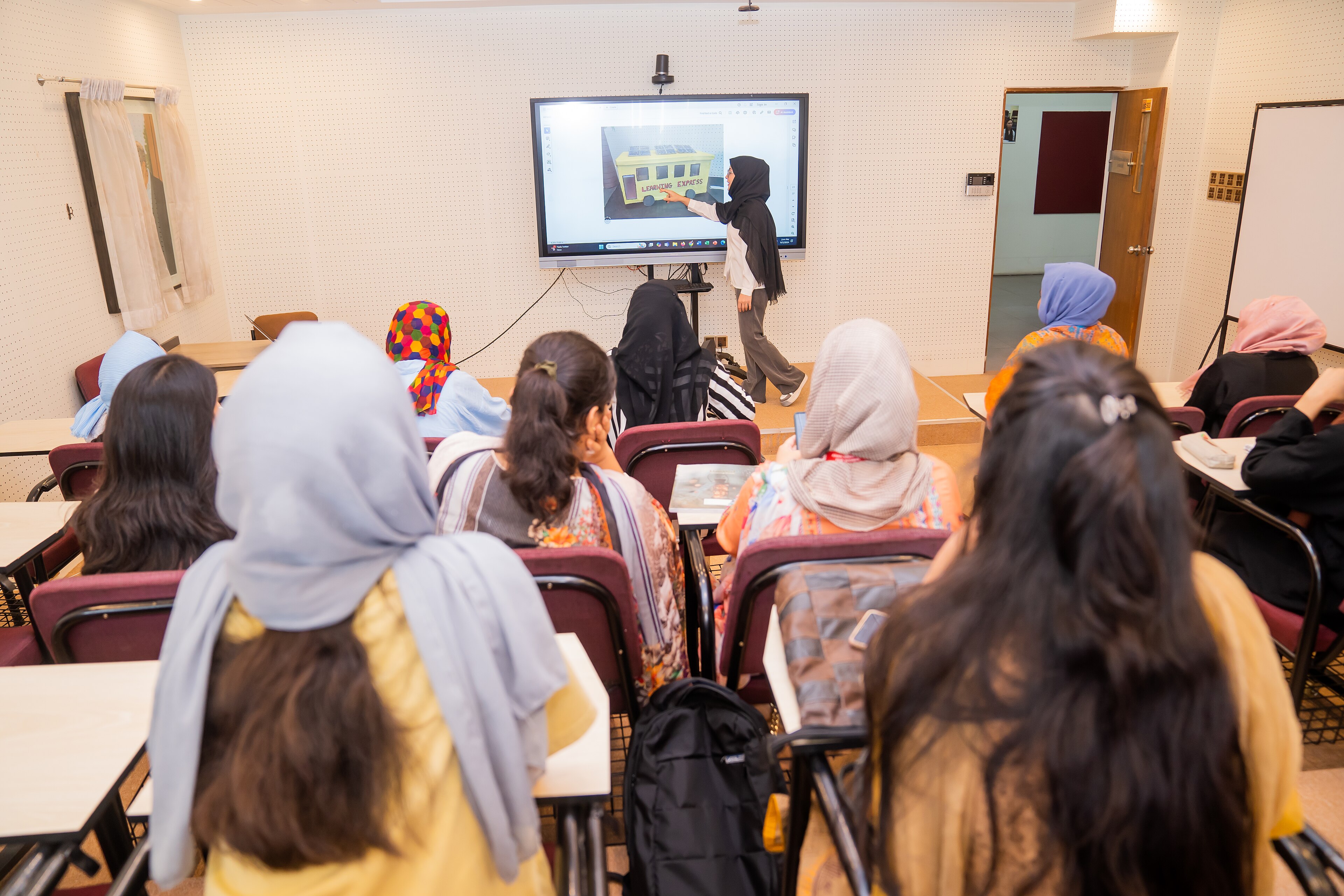 Students studying together in a university classroom in Bangladesh